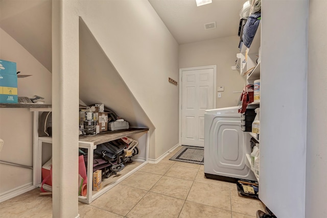 clothes washing area featuring laundry area, visible vents, and tile patterned flooring