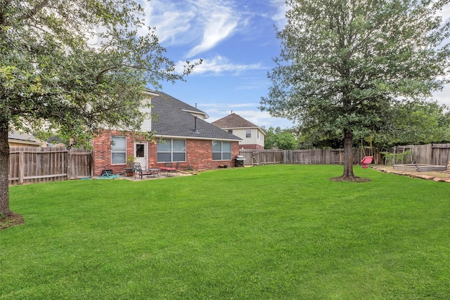 view of yard featuring a patio and a fenced backyard
