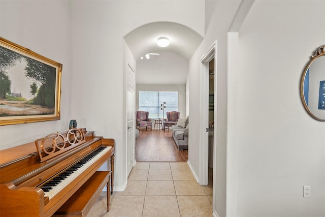 31611 Cape May Ct, Spring, TX 77386 - corridor with light tile patterned flooring, baseboards, and arched walkways