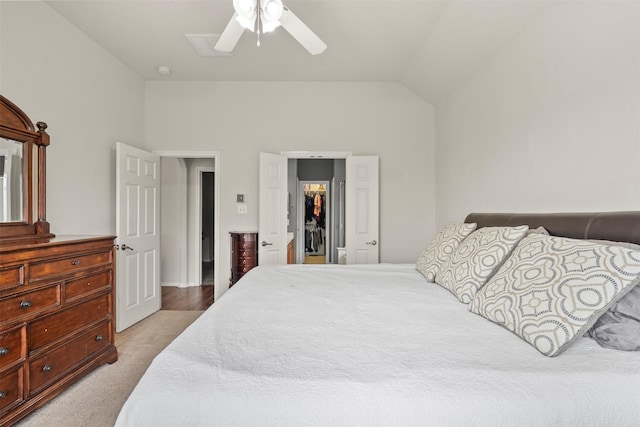 31611 Cape May Ct, Spring, TX 77386 - bedroom featuring a spacious closet, vaulted ceiling, a ceiling fan, carpet, and a closet
