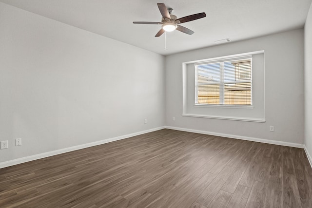 2340 Mooneye Ct, Conroe, TX 77384 - spare room with baseboards, a ceiling fan, dark wood-style floors, and visible vents