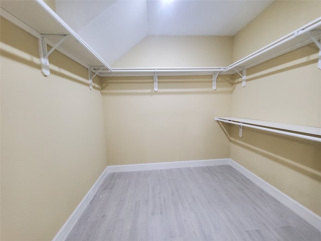 spacious closet featuring light wood-type flooring