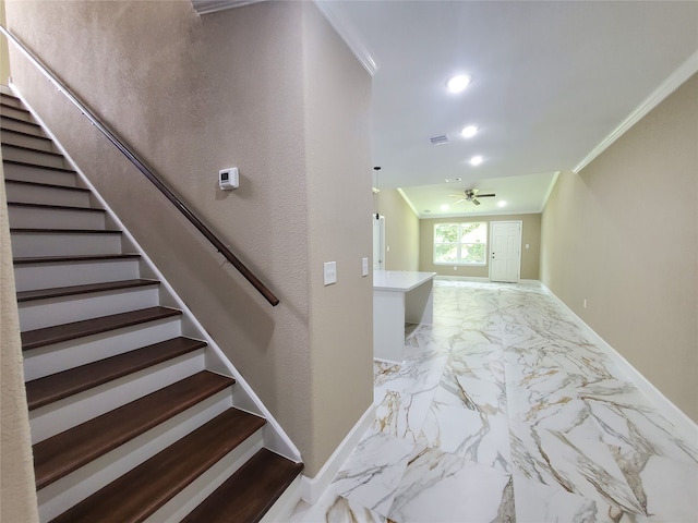 stairs with baseboards, ornamental molding, ceiling fan, and marble finish floor