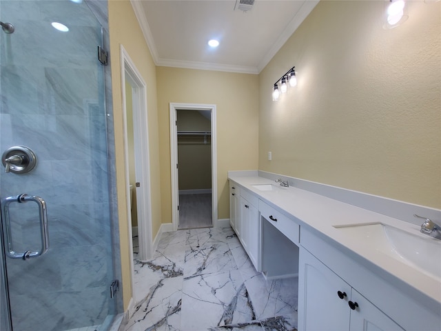 full bathroom featuring crown molding, a sink, a stall shower, and a spacious closet