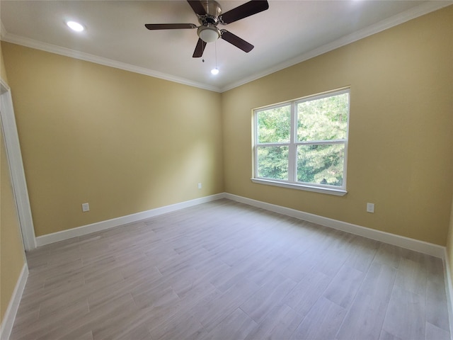 empty room featuring crown molding, ceiling fan, light wood-style flooring, recessed lighting, and baseboards