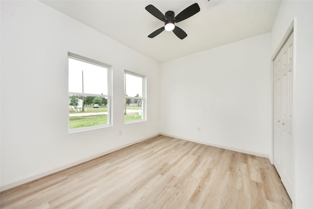 600 Rd 5105, Cleveland, TX 77327 - unfurnished bedroom with a closet, light wood-style flooring, ceiling fan, and baseboards