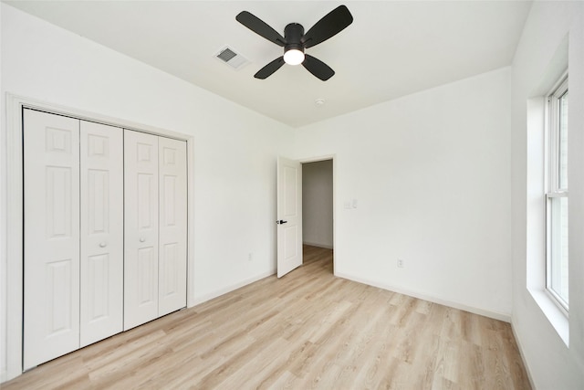 600 Rd 5105, Cleveland, TX 77327 - unfurnished bedroom with visible vents, a closet, baseboards, light wood-type flooring, and a ceiling fan