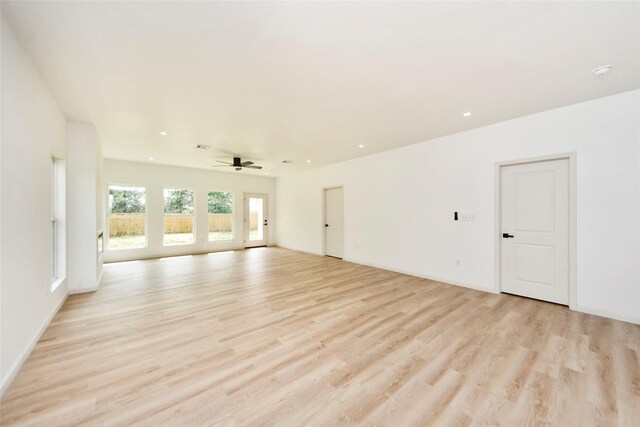 600 Rd 5105, Cleveland, TX 77327 - unfurnished living room featuring light wood-type flooring, a ceiling fan, and recessed lighting