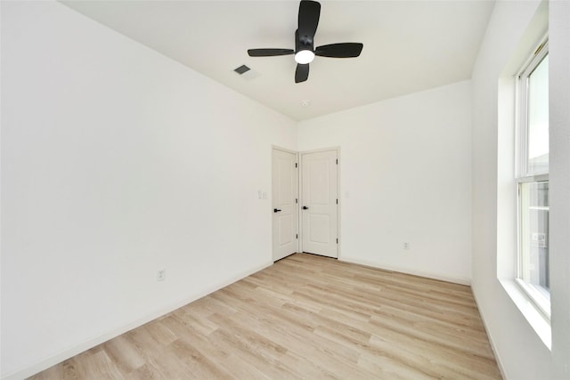 600 Rd 5105, Cleveland, TX 77327 - empty room with visible vents, baseboards, ceiling fan, and light wood-type flooring