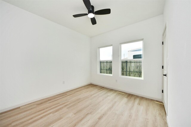 600 Rd 5105, Cleveland, TX 77327 - empty room featuring baseboards, a ceiling fan, and light wood finished floors