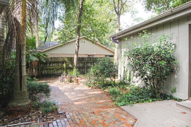 view of yard with fence and a patio area