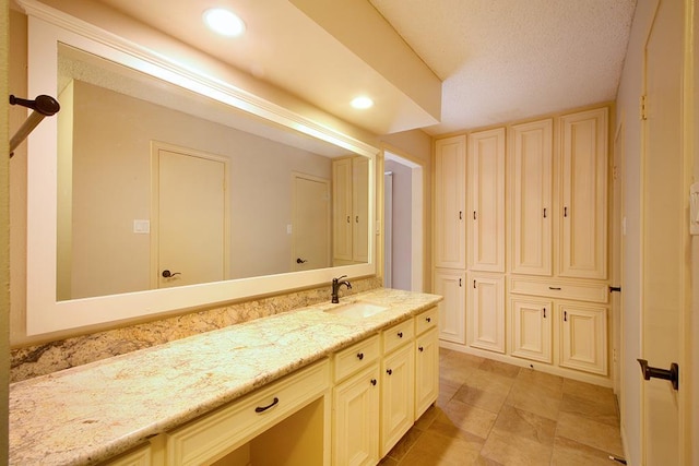 bathroom with recessed lighting and vanity