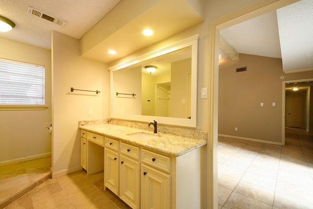 bathroom with visible vents, baseboards, tile patterned flooring, and vanity