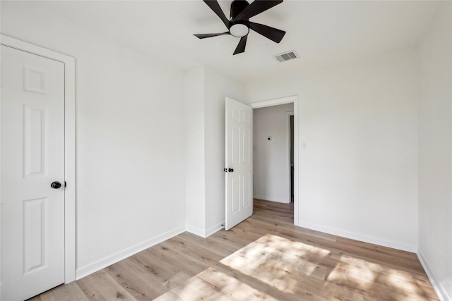 unfurnished bedroom with baseboards, light wood-style flooring, and visible vents