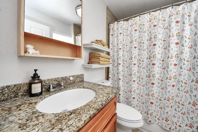 full bathroom with vanity, toilet, and a shower with shower curtain