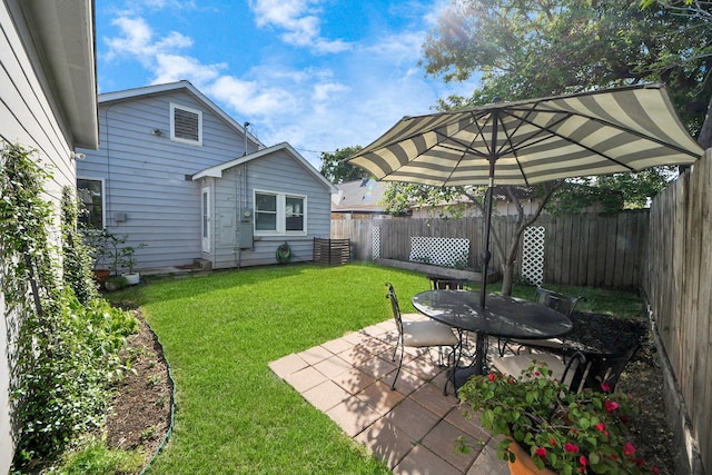 view of yard with a fenced backyard and a patio area