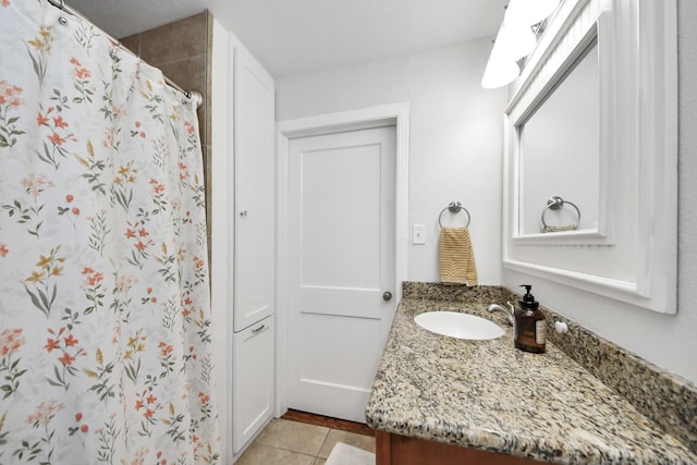 bathroom with vanity, tile patterned flooring, and curtained shower