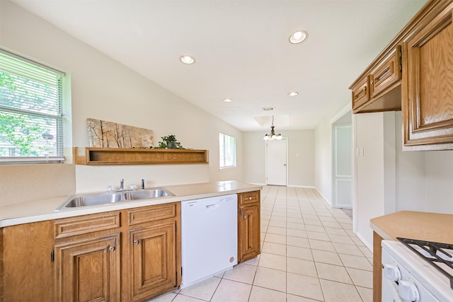 kitchen with a sink, dishwasher, brown cabinets, and light countertops