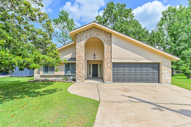 traditional home featuring brick siding, driveway, a front lawn, and a garage