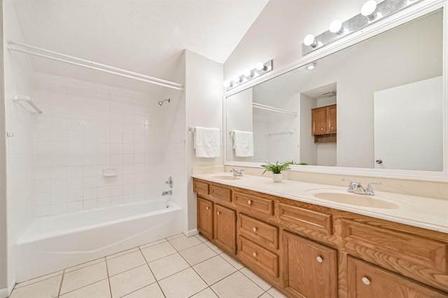 bathroom featuring tile patterned floors, vaulted ceiling,  shower combination, and a sink