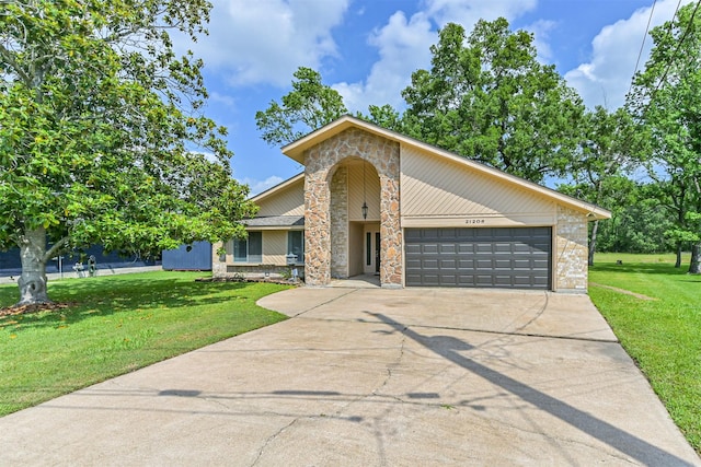 mid-century modern home with an attached garage, a front lawn, driveway, and stone siding