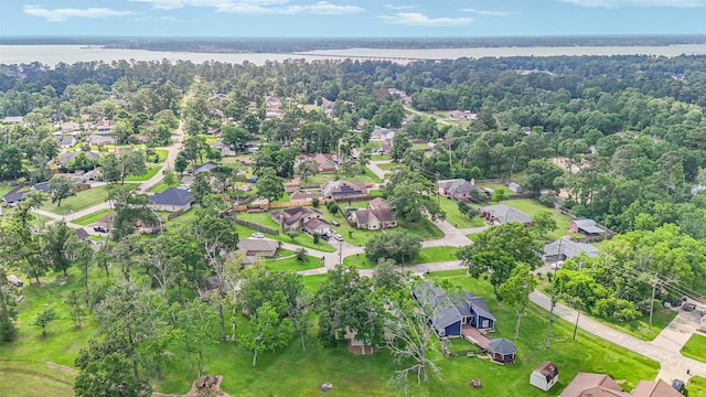 drone / aerial view featuring a water view and a residential view