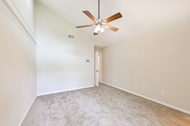 carpeted empty room featuring visible vents, baseboards, ceiling fan, and high vaulted ceiling