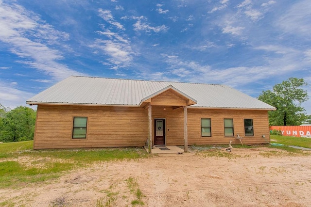 rustic home with metal roof