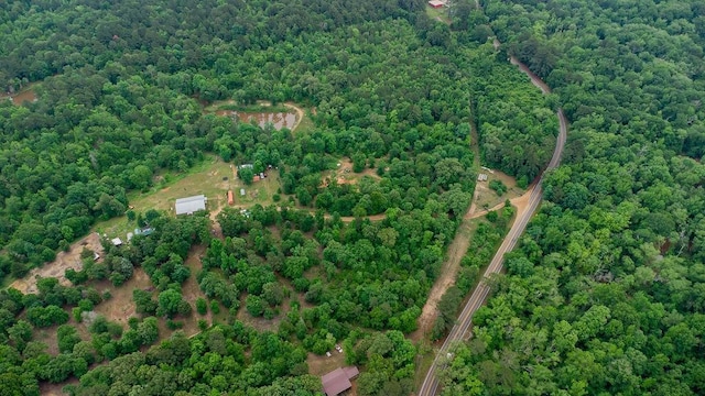 birds eye view of property with a wooded view