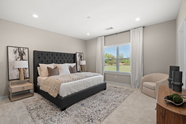 bedroom with baseboards, carpet flooring, and visible vents