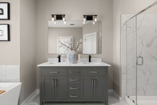 full bathroom featuring a marble finish shower, a sink, and marble finish floor