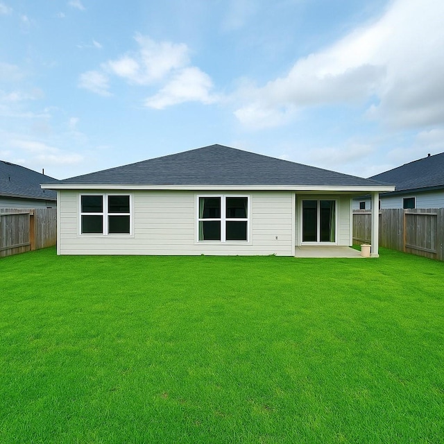 rear view of property with a fenced backyard, a patio, and a lawn