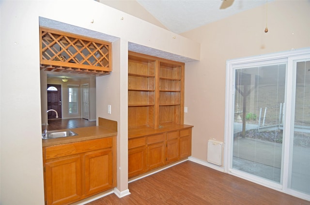 16806 Ashmoor Way, Houston, TX 77058 - bar featuring a sink, vaulted ceiling, wood finished floors, and plenty of natural light