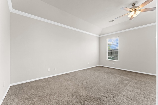 carpeted empty room with visible vents, a ceiling fan, baseboards, and vaulted ceiling