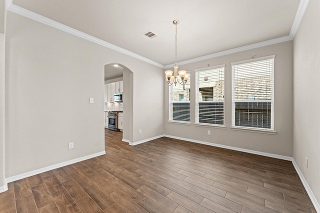 unfurnished dining area featuring visible vents, crown molding, arched walkways, a chandelier, and dark wood-type flooring