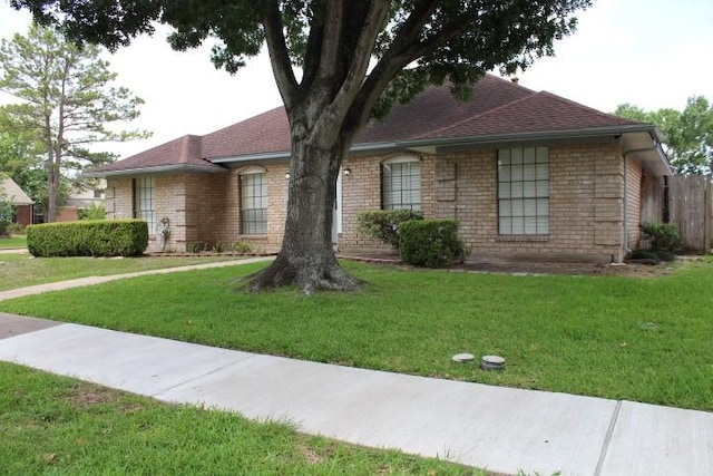 9222 Chesney Downs Dr, Houston, TX 77083 - single story home with a front yard and roof with shingles