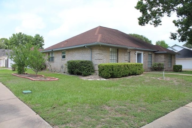 9222 Chesney Downs Dr, Houston, TX 77083 - view of property exterior with a yard and stone siding