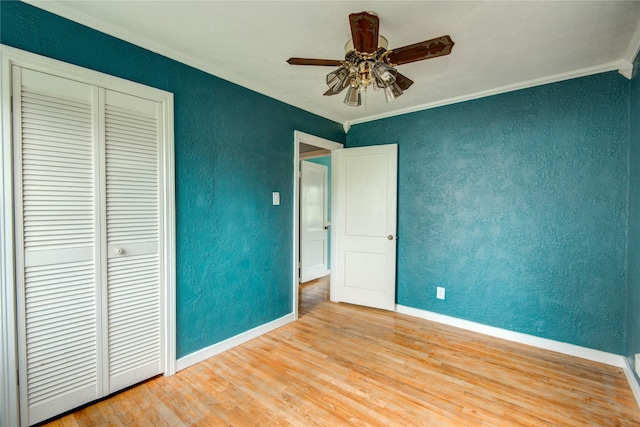 1622 Jennifer Ln, Houston, TX 77029 - unfurnished bedroom featuring crown molding, baseboards, a textured wall, and a closet