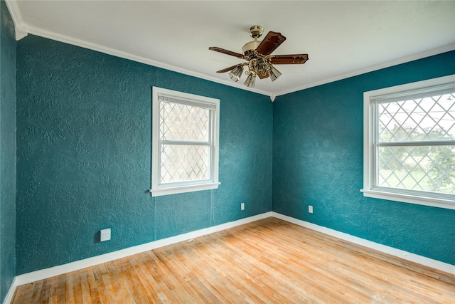 1622 Jennifer Ln, Houston, TX 77029 - spare room featuring crown molding, a textured wall, and a wealth of natural light
