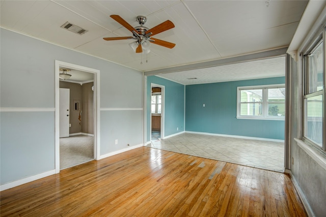1622 Jennifer Ln, Houston, TX 77029 - empty room with light wood-style floors, baseboards, a ceiling fan, and visible vents