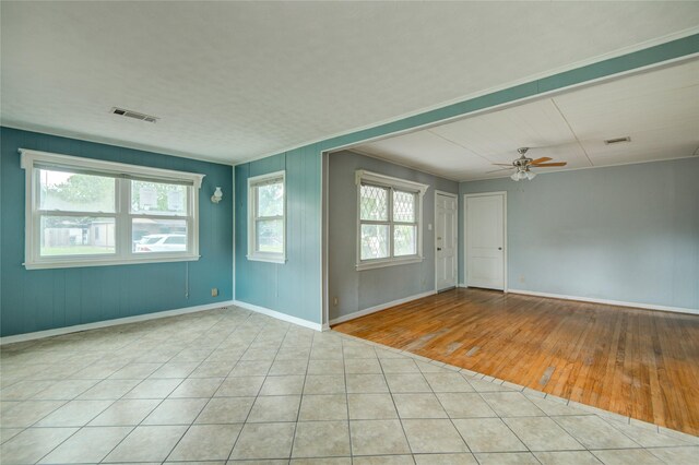 1622 Jennifer Ln, Houston, TX 77029 - tiled spare room with visible vents, a ceiling fan, and baseboards
