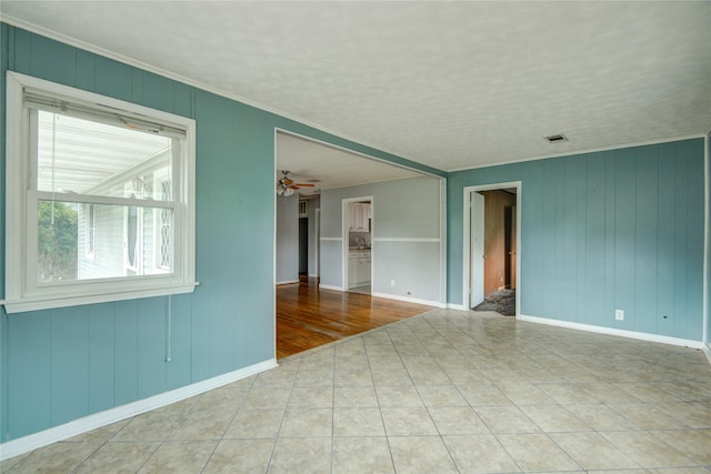 1622 Jennifer Ln, Houston, TX 77029 - unfurnished room with baseboards, visible vents, ornamental molding, and tile patterned flooring