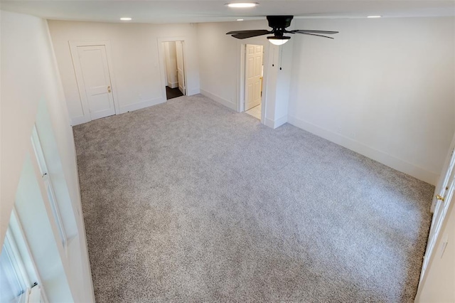 empty room with recessed lighting, baseboards, a ceiling fan, and carpet flooring