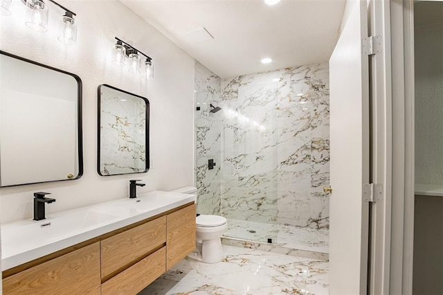full bath with a sink, a marble finish shower, toilet, and marble finish floor