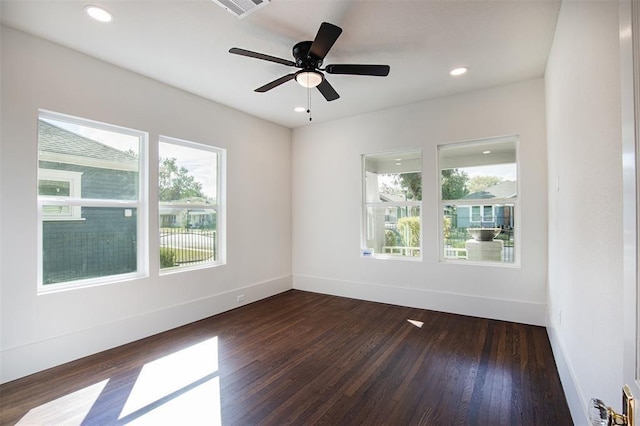 unfurnished room featuring dark wood-style flooring, ceiling fan, recessed lighting, baseboards, and visible vents