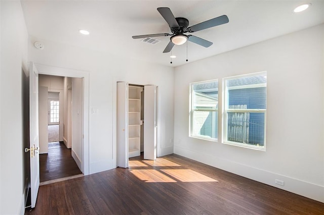 unfurnished bedroom featuring visible vents, wood finished floors, baseboards, recessed lighting, and a ceiling fan