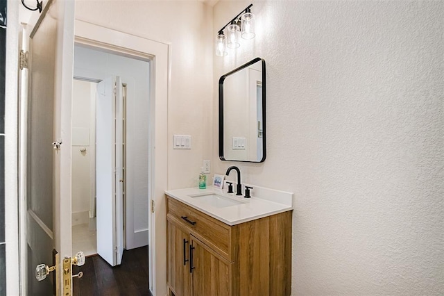 bathroom with vanity and wood finished floors