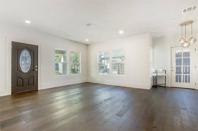 foyer featuring visible vents, recessed lighting, and dark wood-type flooring