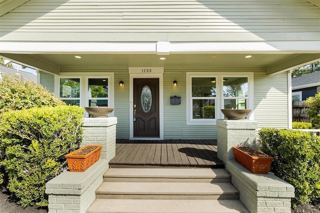 entrance to property featuring a porch