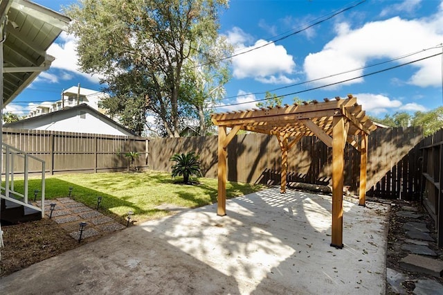 view of yard featuring a pergola, a fenced backyard, and a patio area